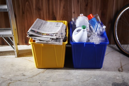 Crews separating recyclables during a house clearance