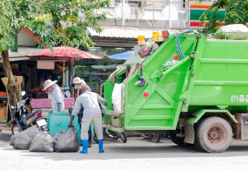 Workers handling clearance items carefully during house clearance
